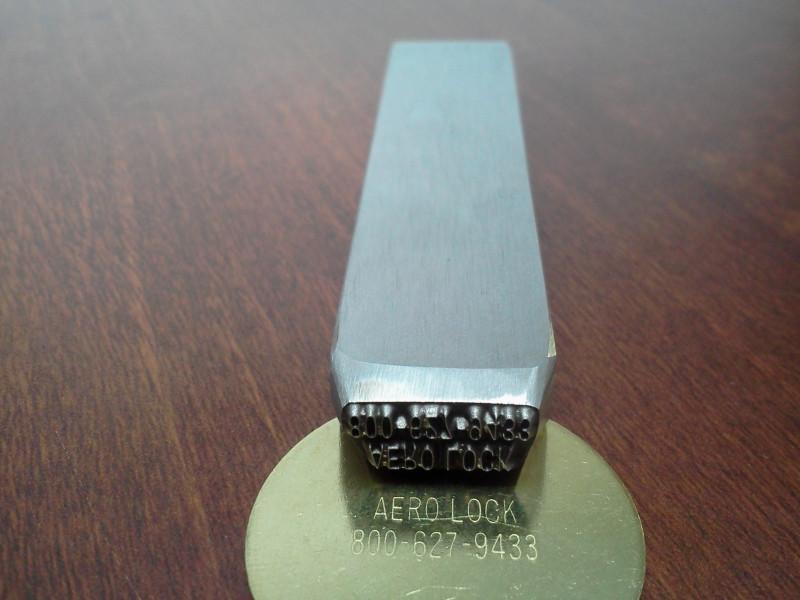 What material is the custom key stamp made from?